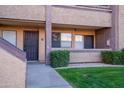 Condo entrance with landscaping and walkway at 3535 W Tierra Buena Ln # 156, Phoenix, AZ 85053