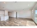 Bright living room with tile floors and sliding glass doors at 36530 W Leonessa Ave, Maricopa, AZ 85138