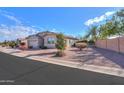 House with a landscaped yard and block wall at 42521 W Sea Eagle Dr, Maricopa, AZ 85138