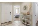 Bright entryway with a view of a bedroom and decorative console table at 4916 E Rhodium Dr, San Tan Valley, AZ 85143