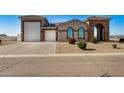 Single-story home with a large garage and landscaped front yard at 6608 N Cima Vista Dr, Casa Grande, AZ 85194