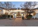 Ornate iron gate leading to a grand estate at 8515 E Sutton Dr, Scottsdale, AZ 85260