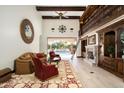 Spacious living room with a fireplace and built-in library at 8515 E Sutton Dr, Scottsdale, AZ 85260