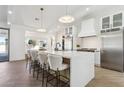 Contemporary kitchen featuring a large island and white cabinets at 9031 N 83Rd Way, Scottsdale, AZ 85258