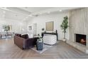 Bright living room features herringbone floors and a cozy fireplace at 9031 N 83Rd Way, Scottsdale, AZ 85258