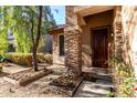 Ornate front door and stone pillars at 10022 N Erin Ct, Waddell, AZ 85355