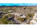 Aerial view of a community with a golf course and desert landscape at 10222 E Southwind Ln # 1026, Scottsdale, AZ 85262