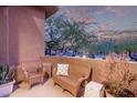 Relaxing patio with wicker furniture offering scenic views at 10222 E Southwind Ln # 1026, Scottsdale, AZ 85262