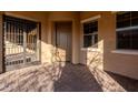 Front entrance with decorative iron gate and brick patio at 10434 E Texas Ave, Mesa, AZ 85212