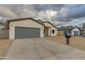 Modern home with gray garage door and neutral exterior at 10869 N 81St Ave, Peoria, AZ 85345