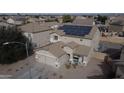 Two-story house with solar panels and a spacious backyard at 11534 W Longley Ln, Youngtown, AZ 85363