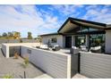 Contemporary patio furniture on a spacious patio with a modern home in the background at 12201 N 65Th St, Scottsdale, AZ 85254