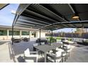 Patio furniture with ample seating under a pergola at 12201 N 65Th St, Scottsdale, AZ 85254