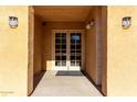 Well-lit building entrance with double doors and a welcoming atmosphere at 14575 W Mountain View Blvd # 12303, Surprise, AZ 85374