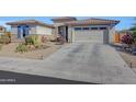 Beautiful one-story home with a two-car garage and drought-tolerant landscaping at 15207 S 183Rd Ave, Goodyear, AZ 85338