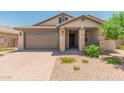 One-story house with brown garage door and stone accents at 16019 W Avenida Del Sol --, Surprise, AZ 85387