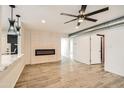 Bright living area featuring a modern electric fireplace and hardwood floors at 17030 E Calaveras Ave, Fountain Hills, AZ 85268