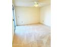 Spacious carpeted bedroom with ceiling fan at 19462 N Star Ridge Dr, Sun City West, AZ 85375