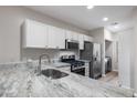 Modern kitchen with granite countertops and stainless steel appliances at 205 N 74Th St # 122, Mesa, AZ 85207