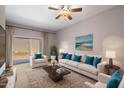 Bright living room with comfy seating and patio access at 205 N 74Th St # 122, Mesa, AZ 85207