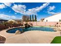 Relaxing kidney shaped pool with waterfall feature at 23242 S 202Nd Way, Queen Creek, AZ 85142