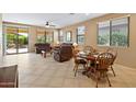 Comfortable living area with plush seating, ceiling fan and an adjacent dining area ready for entertaining at 26171 W Via Del Sol Dr, Buckeye, AZ 85396