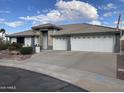 Single-story home with a three-car garage and well-manicured landscaping at 2705 S Copperwood --, Mesa, AZ 85209