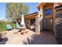 Covered patio with stone tile flooring and outdoor seating at 2747 Leisure World --, Mesa, AZ 85206