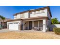 Two-story house with a white garage door and brown roof at 29808 N Yellow Bee Dr, San Tan Valley, AZ 85143