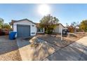 Charming single story home with a gray garage door and spacious yard at 3009 W Potter Dr, Phoenix, AZ 85027