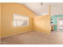 Spacious living room with vaulted ceilings and large window at 3009 W Potter Dr, Phoenix, AZ 85027