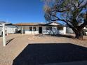 Charming ranch house with carport and mature tree in front yard at 3028 W Bloomfield Rd, Phoenix, AZ 85029