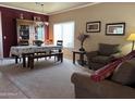 Bright dining room featuring a table and chairs, situated near the living room at 44152 W Pioneer Rd, Maricopa, AZ 85139