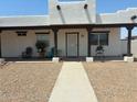 White stucco home with covered porch and walkway to the front door at 50134 W Gail Ln, Maricopa, AZ 85139