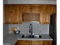 Well-equipped kitchen featuring wood cabinets and quartz countertops at 5031 W Flynn Ln, Glendale, AZ 85301