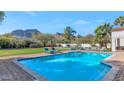 Inviting rectangular pool with brick decking offering beautiful mountain views at 5989 E Sapphire Ln, Paradise Valley, AZ 85253