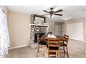 Cozy dining area with stone fireplace and wood table at 632 N 95Th St, Mesa, AZ 85207