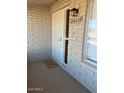 Front entry with security door and welcome mat at 6449 E Dodge St, Mesa, AZ 85205