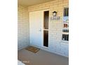 Inviting front entrance with security door, stylish address plaque and welcome mat at 6449 E Dodge St, Mesa, AZ 85205