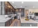 Modern kitchen with stainless steel appliances and an island at 6565 E Thomas Rd # 1015, Scottsdale, AZ 85251