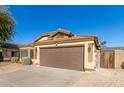 One story house with brown garage door, solar panels, and desert landscaping at 6612 W Paso Trl, Phoenix, AZ 85083