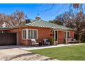 Charming brick home featuring a well-kept front yard and a cozy front porch at 6811 N 11Th Ave, Phoenix, AZ 85013