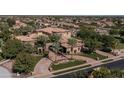 Luxury home with circular driveway and manicured landscaping at 6876 S Star Dr, Gilbert, AZ 85298