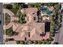 Bird's-eye view of a large home with tile roof and pool at 6876 S Star Dr, Gilbert, AZ 85298