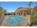 Inviting kidney-shaped pool with spacious patio at 7261 E Black Rock Rd, Scottsdale, AZ 85255