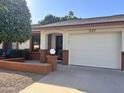 Ranch style home with a two-car garage and well-maintained landscaping at 8020 E Keats Ave # 327, Mesa, AZ 85209