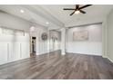 Open living room with hardwood floors and neutral decor at 10709 E Thornton Ave, Mesa, AZ 85212