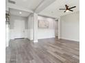 Bright and airy living room with hardwood floors and neutral colors at 10709 E Thornton Ave, Mesa, AZ 85212