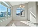 Bright breakfast nook with tile flooring and large windows at 10932 W Morten Ave, Glendale, AZ 85307