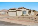 Charming one-story home with a two-car garage and well-maintained landscaping at 10932 W Morten Ave, Glendale, AZ 85307